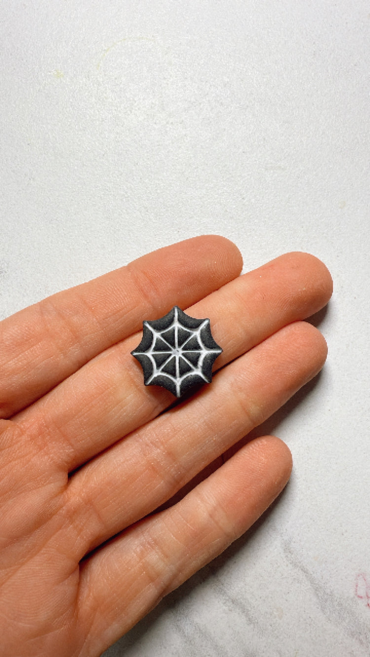 Spider web charm