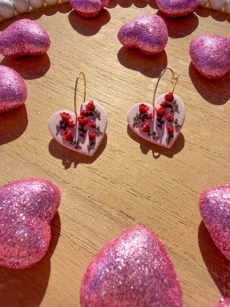 Pink polymer clay heart earrings with red roses