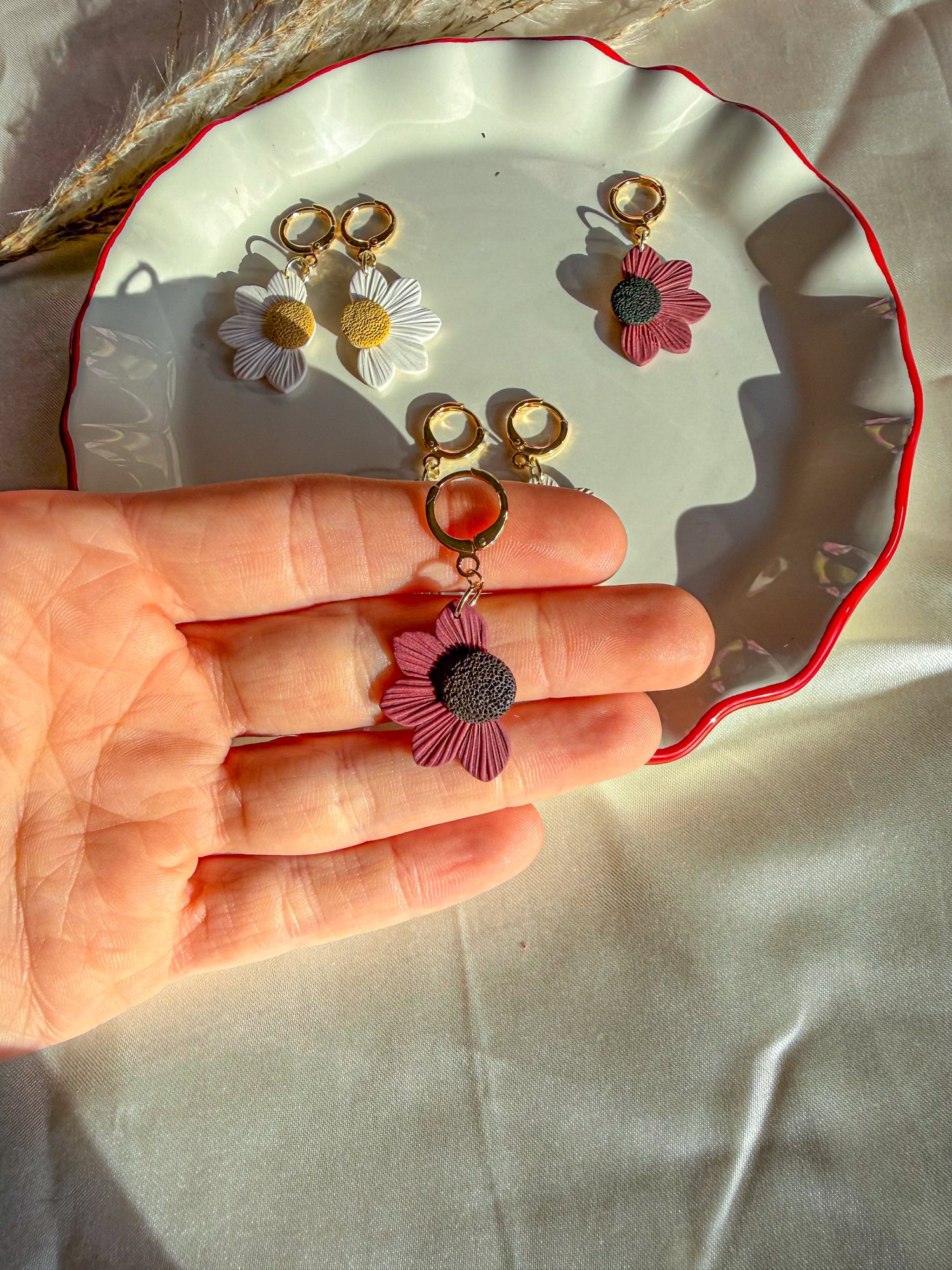 Red daisy flower dangle earrings
