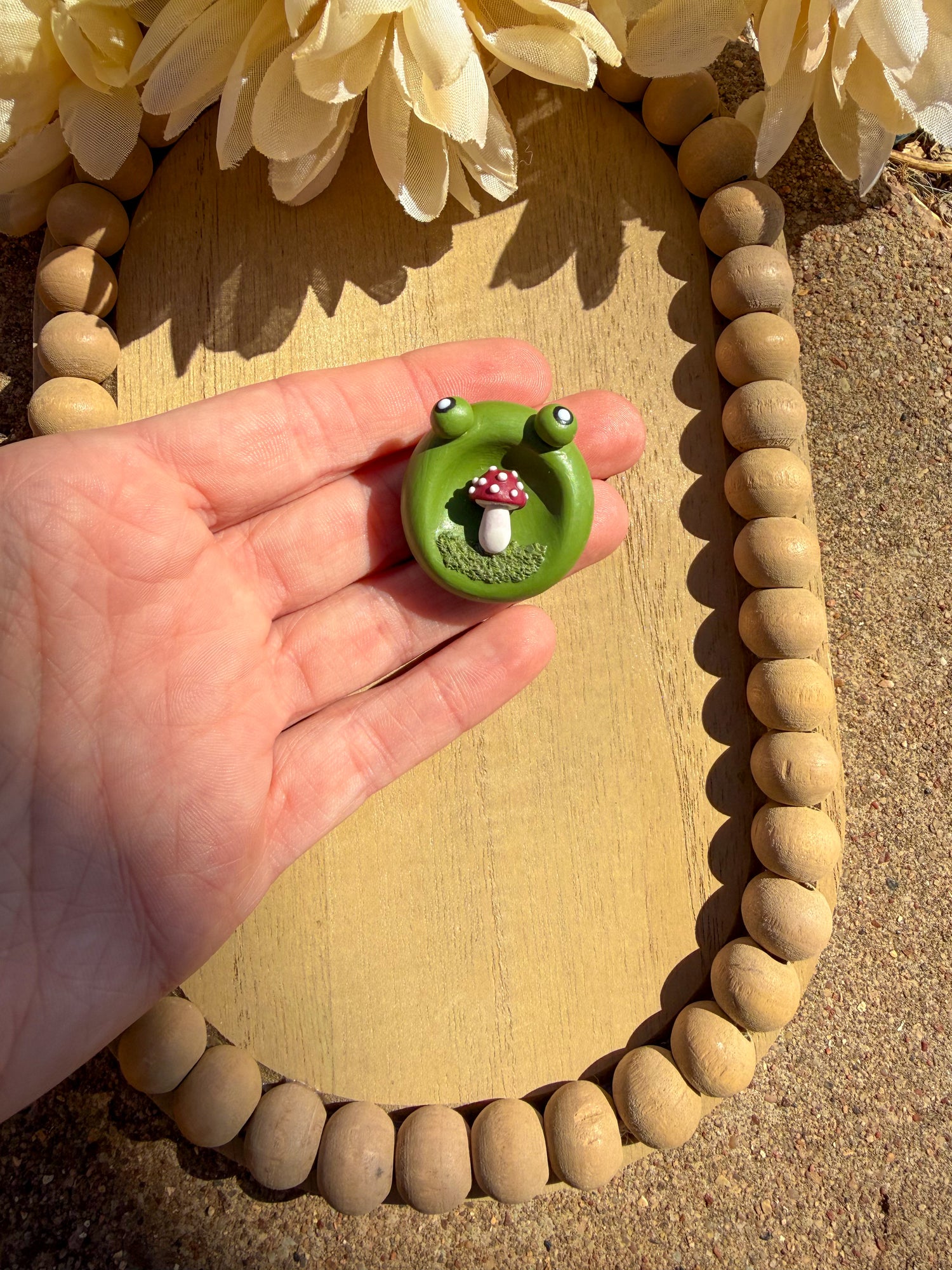 Kawaii frog worry stone with mushroom