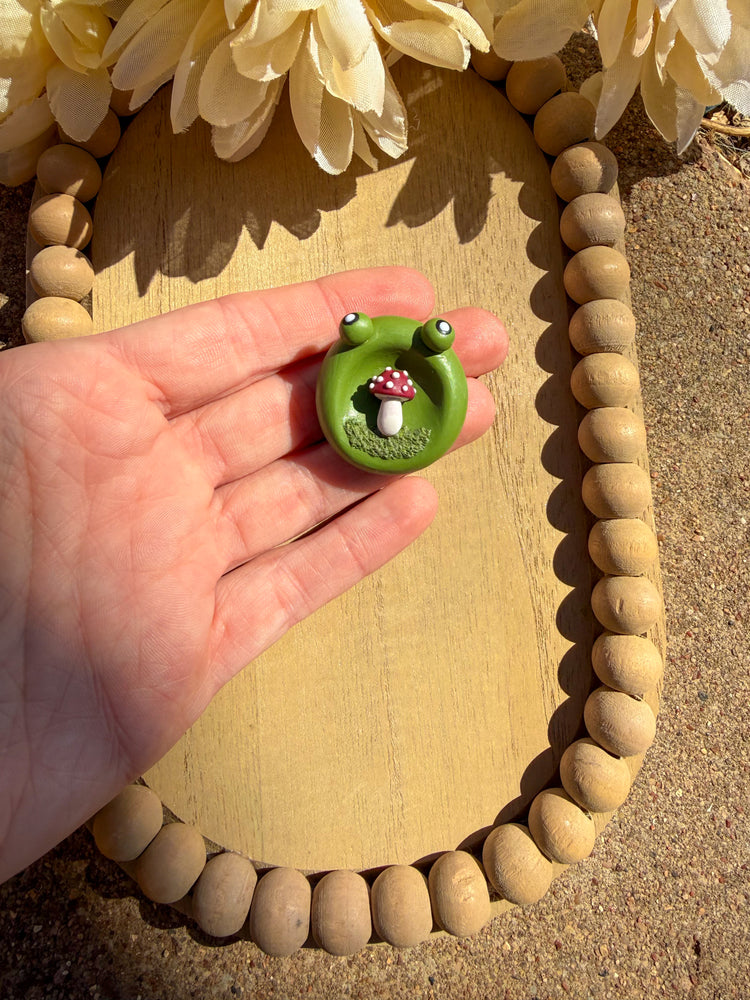 Kawaii frog worry stone with mushroom