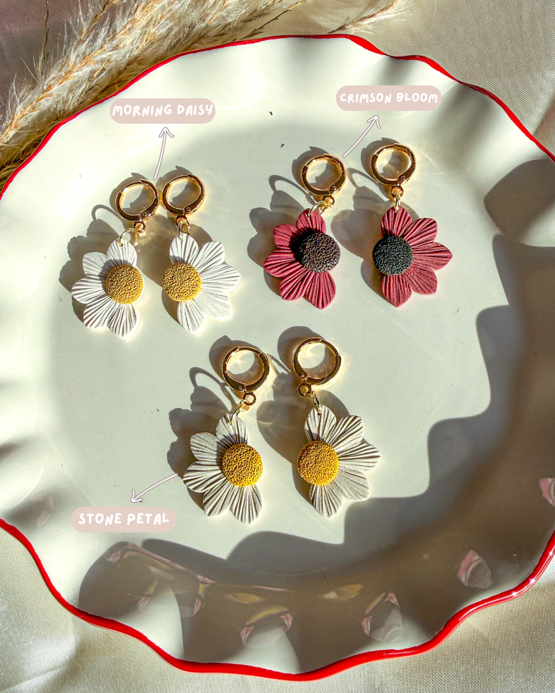 Simple Daisy flower earrings in red, white, and beige colors.