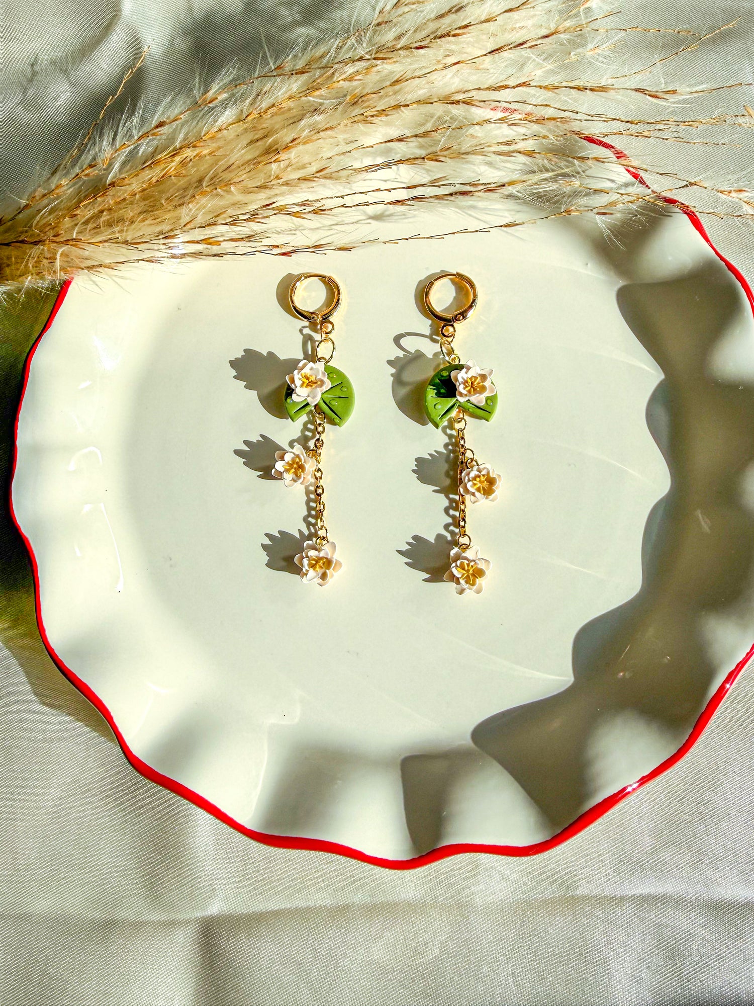 handmade lily pad flower earrings with white blossom flowers with gold lever back earring post