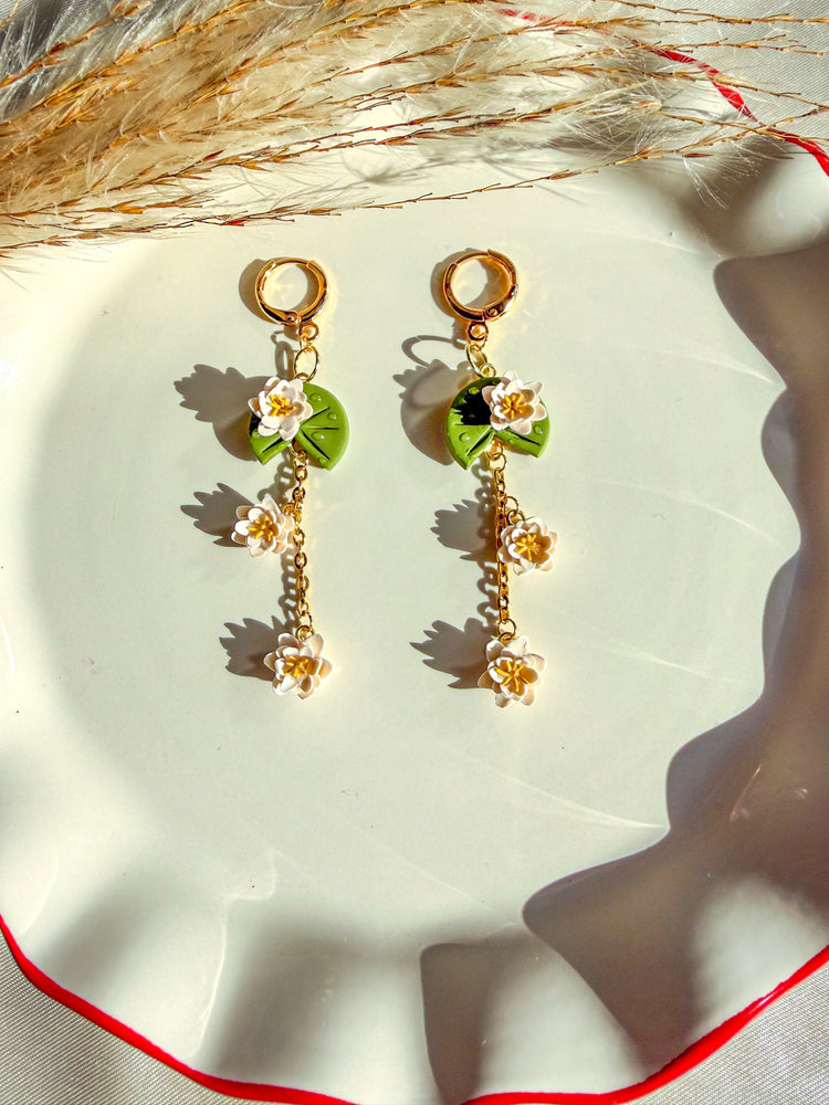 handmade lily pad flower earrings with white blossom flowers dangling