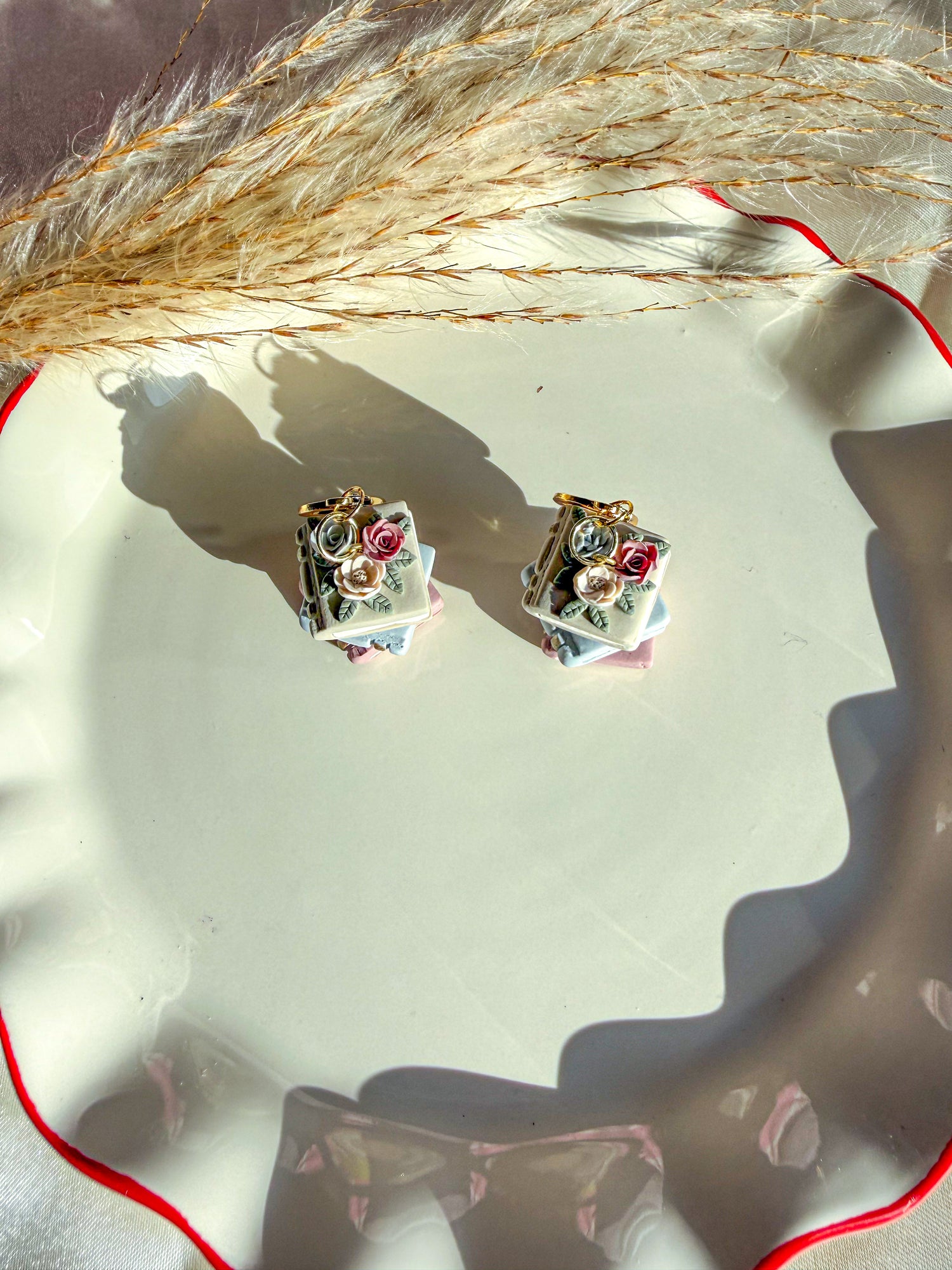 Pair of neutral spring colored book earrings