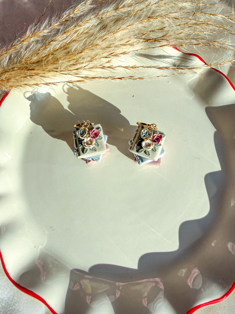 Pair of neutral spring colored book earrings