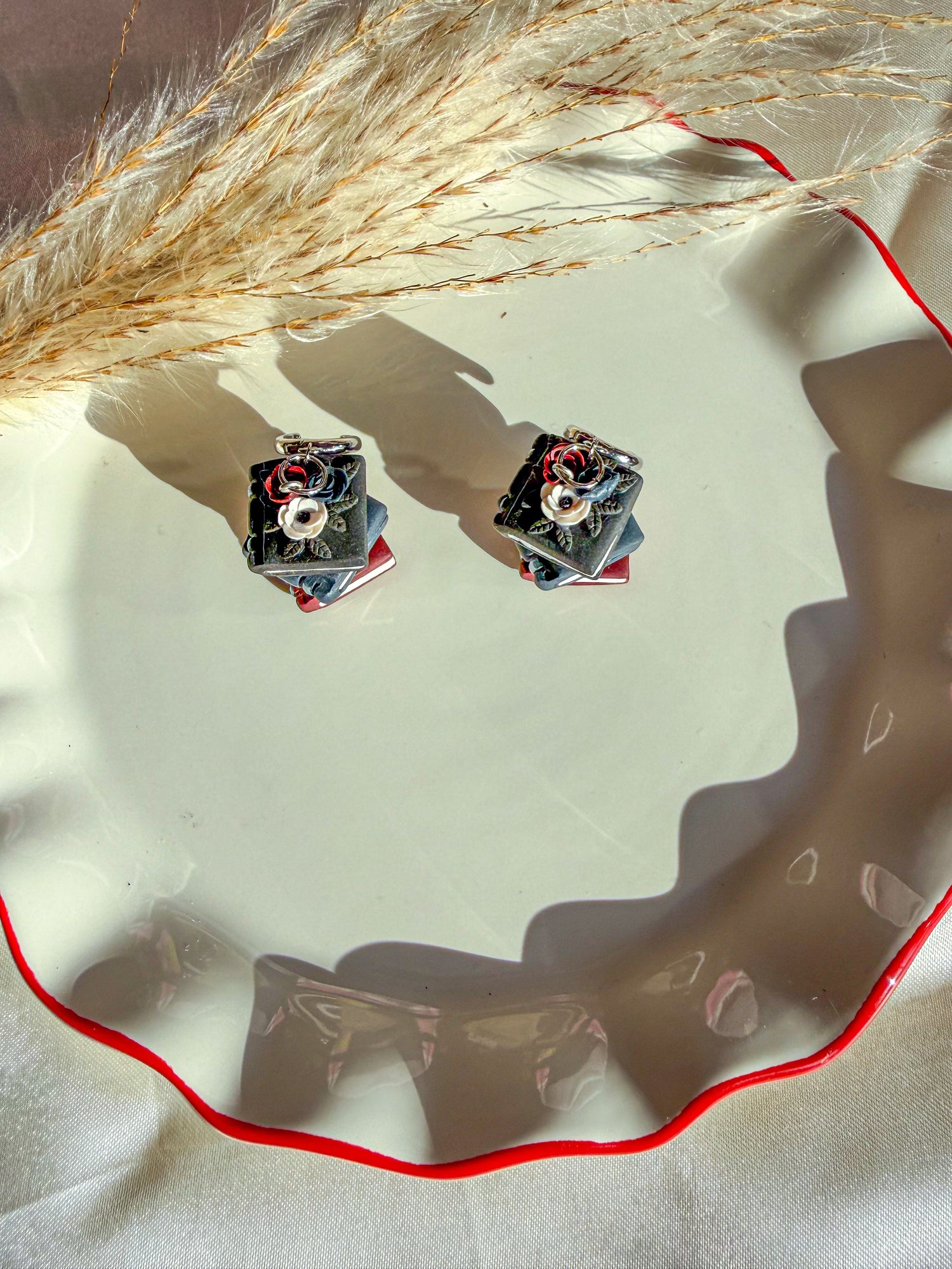 Black, navy, deep red book stacked dangle earrings with dark accents flowers on top 