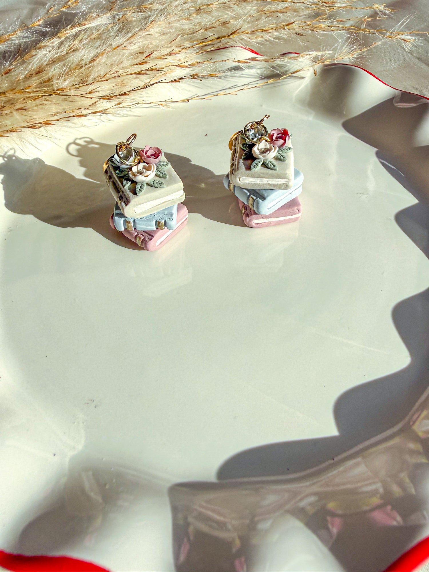 Botanical book stack polymer clay dangle earrings for book lovers