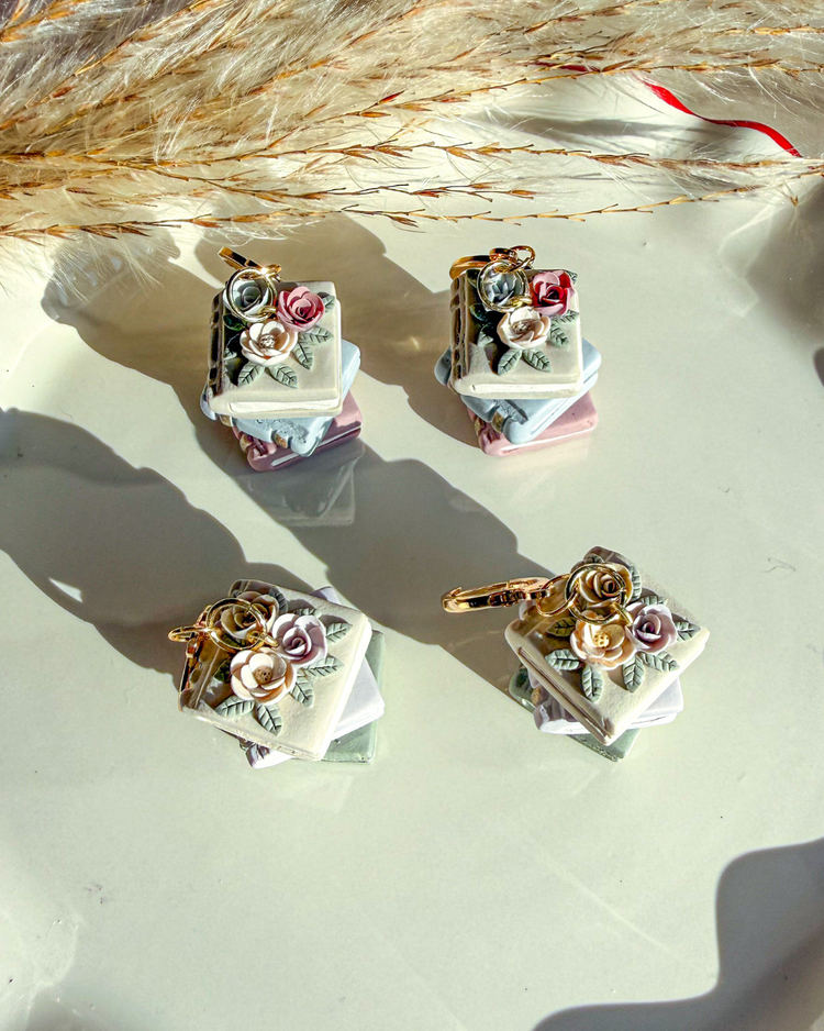 Close up of neutral spring color flowers on books