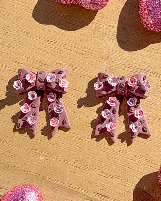 Mauve pink bow stud clay earrings with purple and pink rose flowers