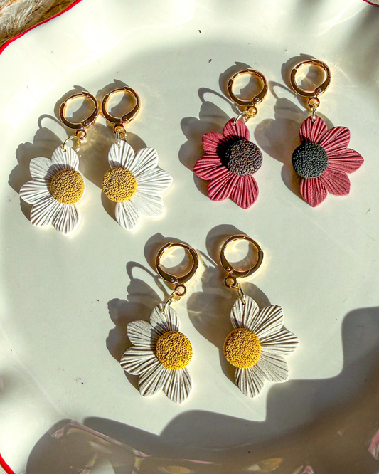 White, beige, and red daisy earrings 